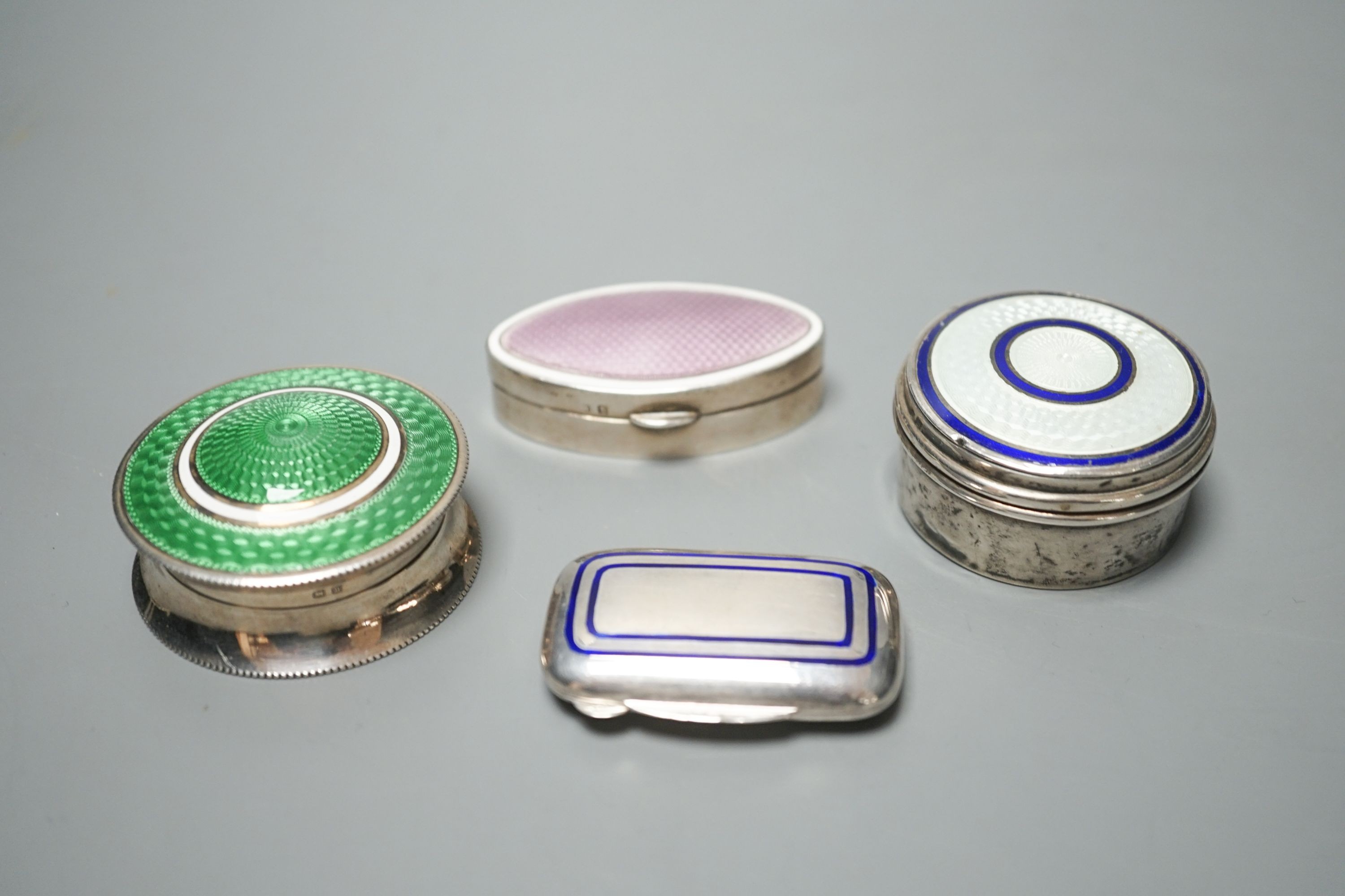 Three assorted early 20th century silver and enamel pill boxes, largest 49mm and a later similar Italian 925 box.